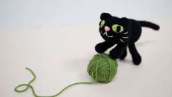 A black crocheted cat made in Twinkie Chan's Creativebug class.