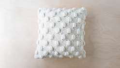 The Impossible Dreamer cushion, knit in one piece in Crazy Sexy Wool on large needles and then seemed together to form an envelope-style enclosure.