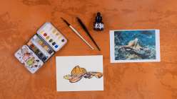 An overhead image of a monoprinted image made with acrylic ink and watercolor.