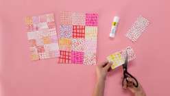 A pair of hands cutting up patterned paper in  Lisa Congdon's Developing your Visual Vocabulary daily practice class on Creativebug