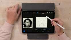 Hands above a tablet sketching a portrait in David Tenorio's Digital Drawing in Procreate class on Creativebug