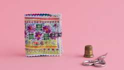 A colorful needle book made in Rebecca Ringquist's Make a Pin Cushion and Needle Case class on Creativebug.