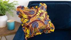 A colorful pillow made in Faith Hale's Sew a Ruffled Pillow Cover class on Creativebug.