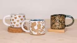 Three handmade mugs made by Cindy Willingham in her Surface Design on Ceramics class on Creativebug.