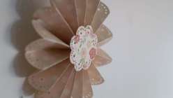 Lia Griffith teaches you how to make scalloped, frilly paper fans that are perfect for a diy wedding or backyard party project. Learn a fold-up version made with a Cricut Explore cutting machine or hand paper crafting.