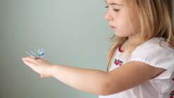 Annabel Wrigley demonstrates how to make paper butterfly rings using a Cricut Explore machine in this crafts for kids class. Learn how to decorate your butterfly shapes using watercolors, gel pens, and a felt tip marker in children's crafting lesson.