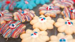 A selection of decorated Spritz cookies made in The Wilton Method: Spritz Cookies class on Creativebug.