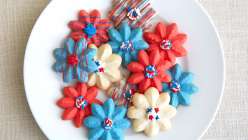 A selection of decorated Spritz cookies made in The Wilton Method: Spritz Cookies class on Creativebug.