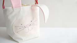 Annabel Wrigley teaches this class to make a natural-colored canvas and pink felt basket in this Easter craft class. This basket features a stitched bunny face, big floppy ears and is a great spring craft idea for kids.