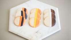 Stefanie from Wilton demonstrates two different methods for dipping cookies and pretzels: an ombre effect and a striped effect. These are great cookies and pretzels to wow guests at holidays, birthdays, Halloween and celebrations year round.